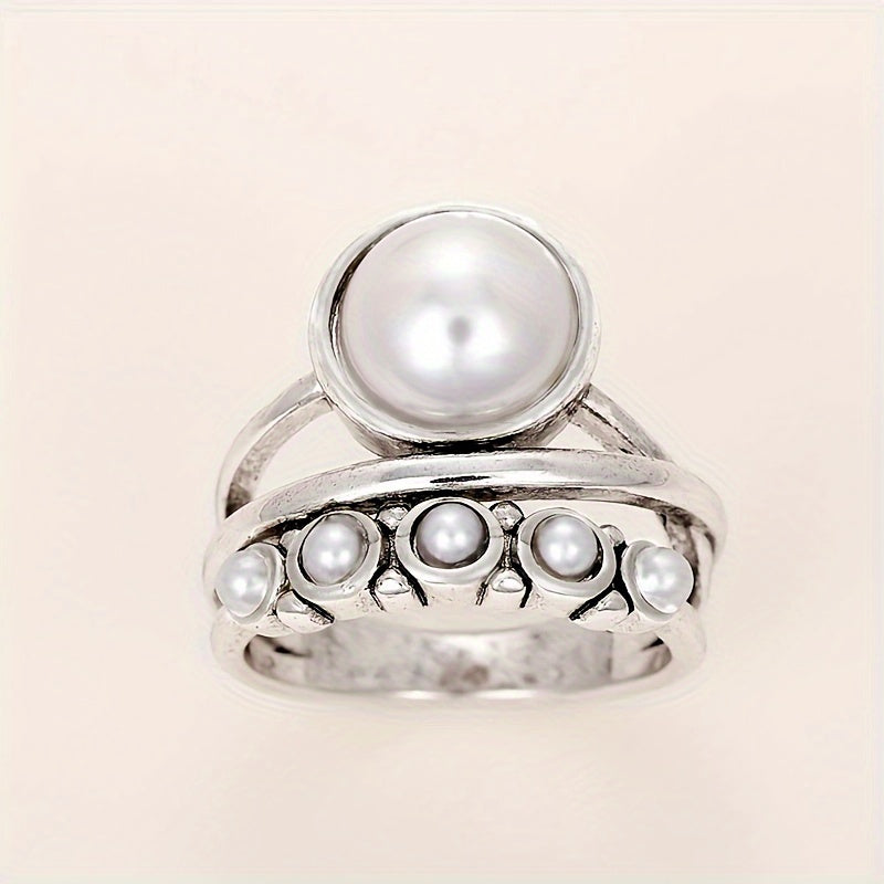 Vintage ring med konstpärla och lagerdesign