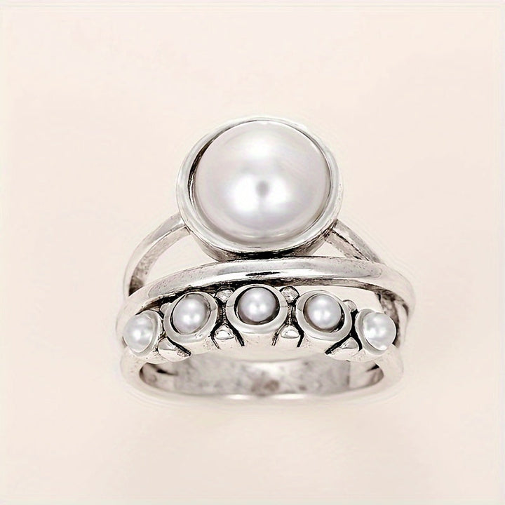 Vintage ring med konstpärla och lagerdesign